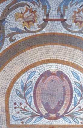 The front porch greets visitors with intricate mosaic tiling.  Once inside the iron and glass doors, the mosaic pattern repeats itself in the sun porch.