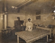 The Bullitt family servant Emily in the basement kitchen of the Oxmoor house, ca. 1910. Bullitt Family Papers, The Filson Historical Society
