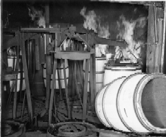 Charring barrels at Louisville cooperage, ca. 1955. Filson Photograph Collection